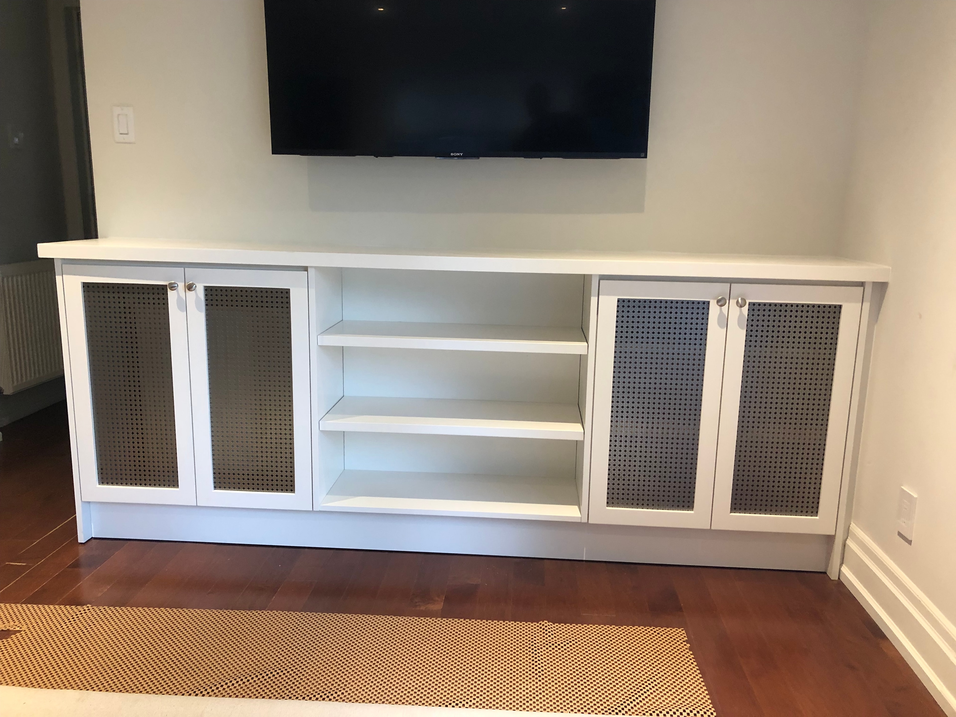 White TV stand with glass cabinet doors